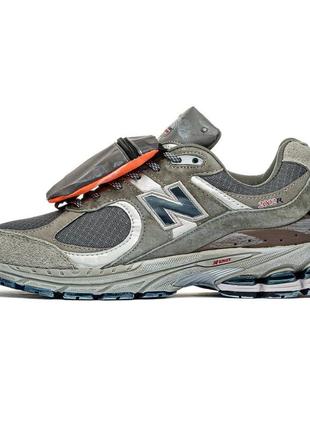 New balance 2002r grey brown pouch