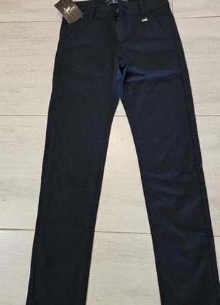 Новые темно-синие брюки на мальчика 146