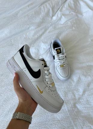 Nike air force gold swoosh