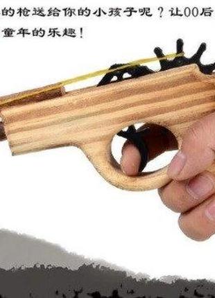 Деревянный пистолет стреляющий резинками7 фото