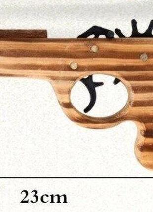 Деревянный пистолет стреляющий резинками6 фото