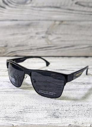 Сонцезахисні окуляри чоловічі, чорні, з поляризацією в пластиковій глянсовій оправі