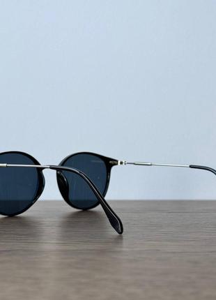 Изящные солнцезащитные очки с темными линзами5 фото