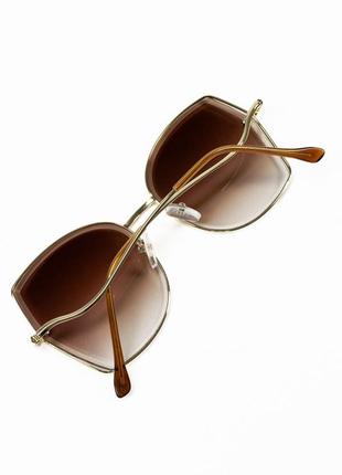 Коричневые солнцезащитные очки с оправой бабочкой2 фото