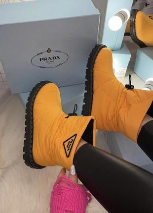 Оберіть стильні кросівки prada quilted nylon snow boots orange