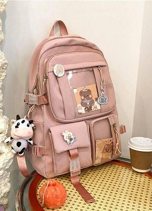 Великий місткий текстильний рюкзак з брелком та значками. рожевий