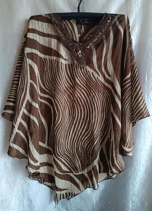 Очень красивая женская блузка туника под шифон.
 цвет - коричневый, бежевый.
состав: 100%полиэстер.
б/у в очень хорошем состоянии