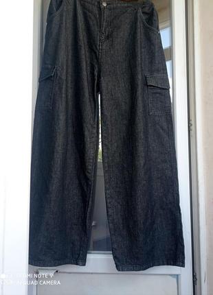 Темно-серые широкие джинсы палаццо с высокой посадкой10 фото