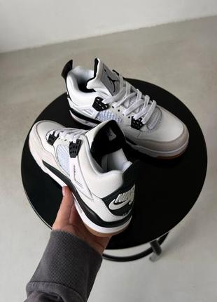 Жіночі кросівки nike jordan 4 black white sb5 фото