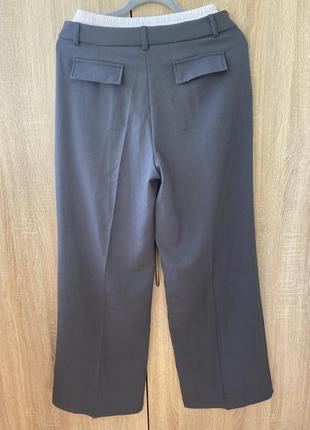 Женские брюки палаццо с имитацией белья широкие с высокой посадкой резинкой на талии5 фото