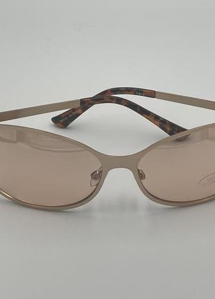 Золотые солнцезащитные очки с закругленной металлической оправой2 фото