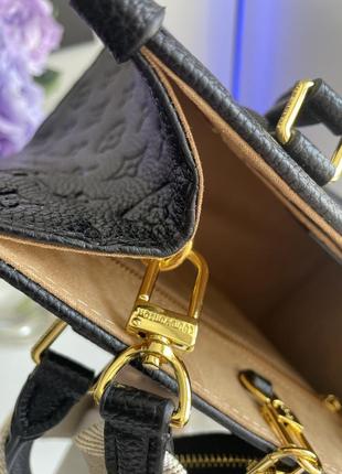 Чорна зерниста шкіряна натуральна жіноча сумка louis vuitton шлеппер луї віттом широкий ремінець на плечі лого10 фото
