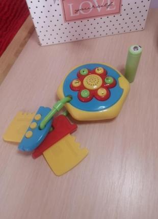 Развивающая игрушка - фонарик и различные звуки