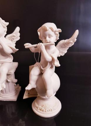 Статуетка -фігурка ангел музикант на кулі4 фото
