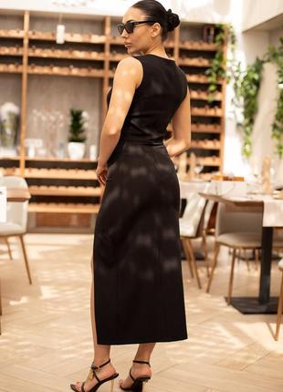 Черная юбка-миди с разрезом юбка с высокой посадкой черного цвета8 фото