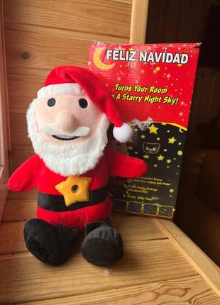 М'яка іграшка нічник-проєктор дід мороз feliz navidad