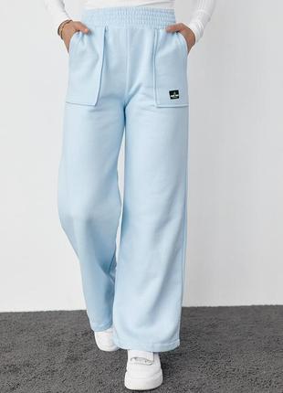 Жіночі штани широкі  на флісі теплі  трикотажні зимові з накладними кишенями 3-нитка блакитний колір s m l