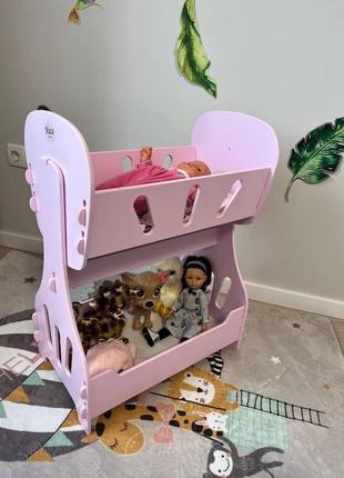 Іграшкова кроватка-качалка рожева дерев'яна для ляльок.