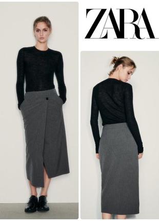 Спідниця середньої довжини із запахом на бік розмір м