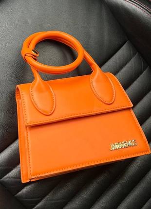 Женская яркая оранжевая сумка типа жакмюс