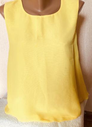 Блузка без рукавів
