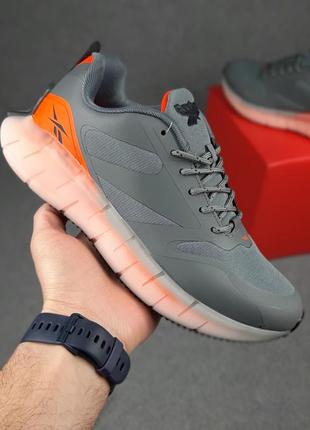 Reebok сірі з помаранчевим