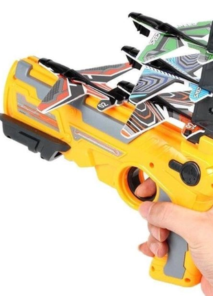 Детский игрушечный пистолет с самолетиками air battle катапульта с летающими самолётами оранжевый (ab-