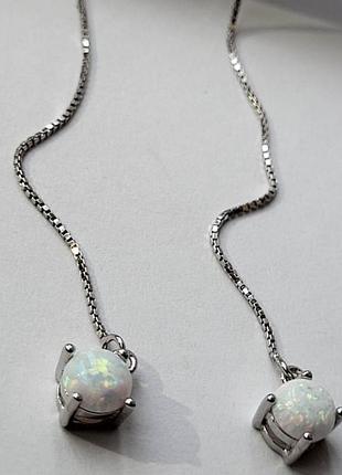 Срібні сережки протяжки з білими опалами