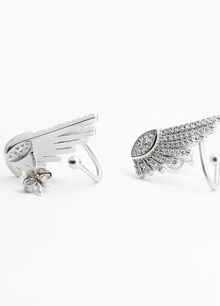 Серебряные серьги пусеты крылья с фианитами с эффектом каффы
