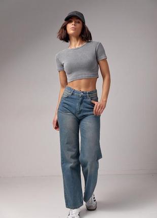 Женские джинсы с эффектом потертости