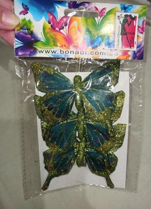 Гарний набір блискучих декоративних метеликів на прищіпці