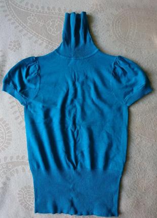 Гольф бiрюзово кольору с горлом без рукава