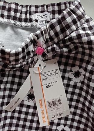 Нова розкльошена спідниця для дівчинки в карту з квітами принт