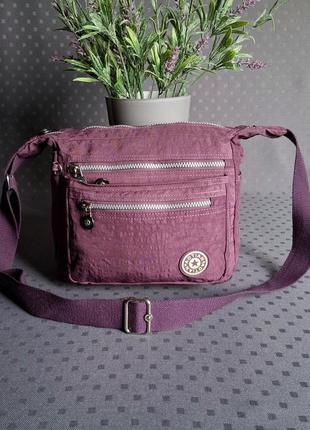 Красивая фиолетовая сумка фирмы aotian в новом состоянии