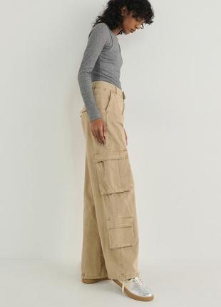 Трендові брюки з карманами від zara