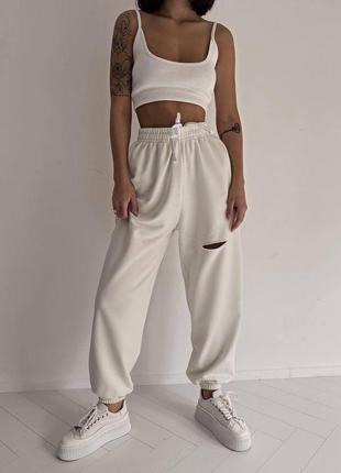 Жіночі літні трикотажні штани-джогери з розрізом розміри 42-50