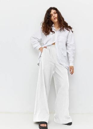 Жіночі широкі штани білі літні modna kazka mkrm4087-2