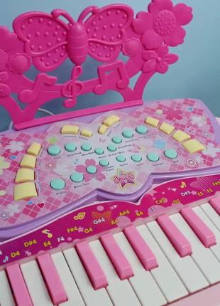 Детское пианино-синтезатор 6618 на ножках со стульчиком (розовое) от батареек и сети, mp34 фото