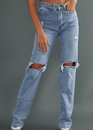 Рваные джинсы с высокой посадкой. модные джинсы с дырками