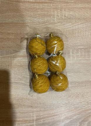 Новорічні іграшки жовта хвиля