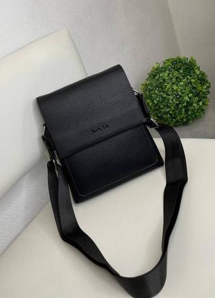Черная, мужская сумка+длинный регулируемый текстильный ремешок.