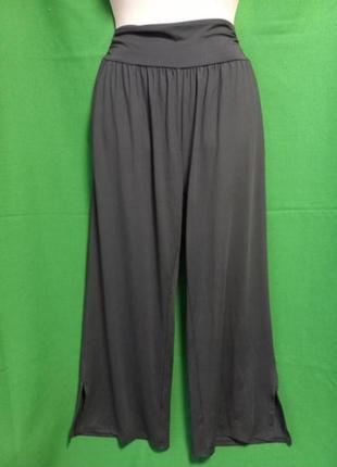 Ueu спортивні еластичні штани на високій посадці, з кишенями та розрізами на штанинах2 фото