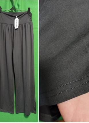 Ueu спортивні еластичні штани на високій посадці, з кишенями та розрізами на штанинах7 фото