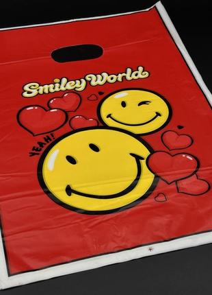 Подарункові поліетиленові пакети 25х35см "smiley world". колір червоний.