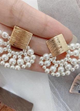 Тренд золотисті жіночі сережки кульчики підвіси перлини перли намистини
