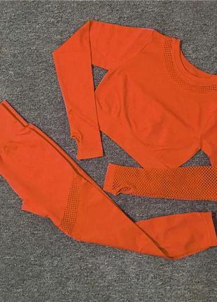 Спортивний костюм з перфорацією без пуш-ап (рашгард та легінси) помаранчевого кольору, розмір s