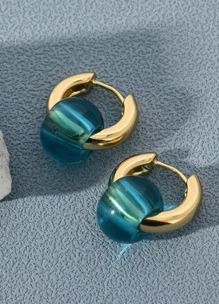 Тренд стильні золотисті сережки кульчики пусети кільця підвіси блакитні намистини