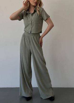 Жіночий трикотажний літній костюм з брюками кльош