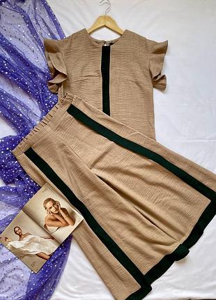 Интересный стильный женский костюм с широкими кюлотами