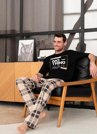 Чоловіча бавовняна піжама домашній чоловічий піжамний комплект штани в карту та чорна футболка з принтом7 фото